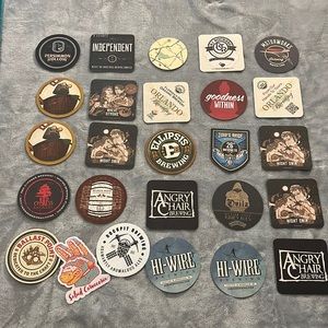 Set of beer brewery coasters and stickers. Great for the collector or home bar.